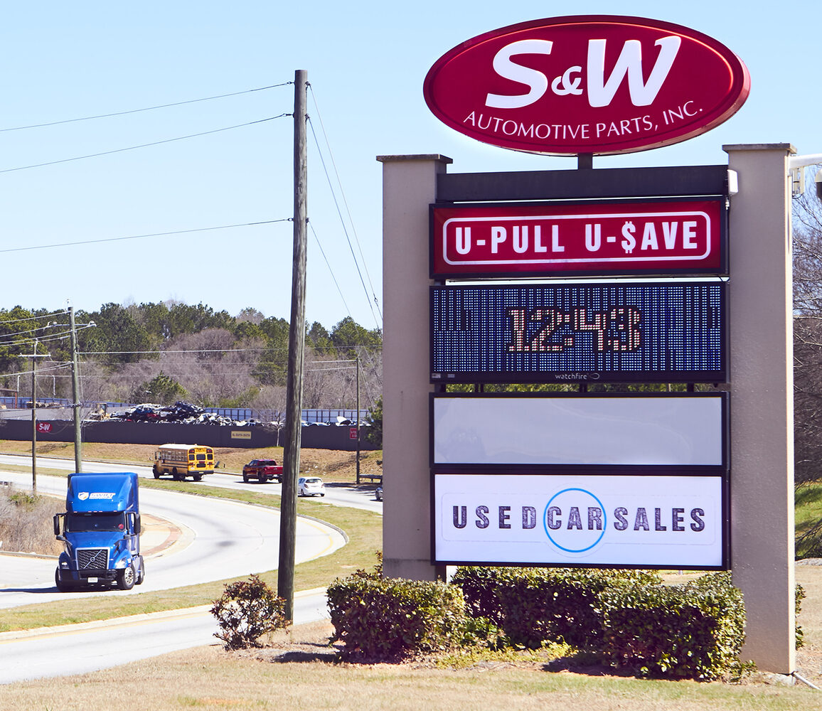 S&W Automotive Parts sign advertising U-Pull and used car sales