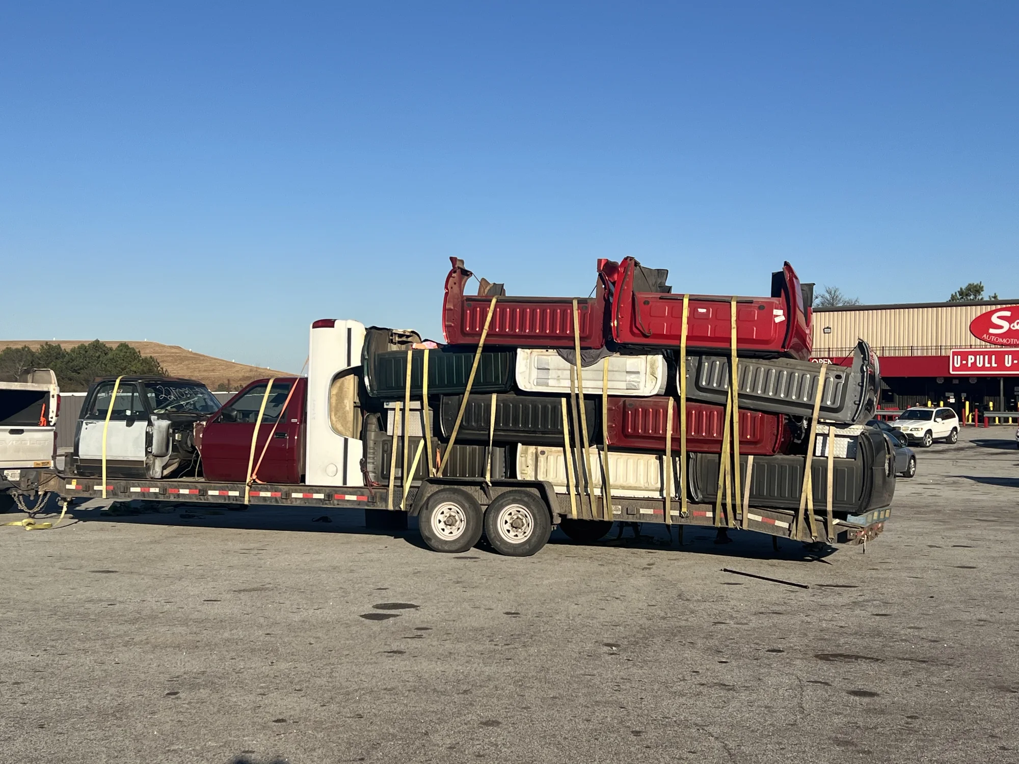 Recovered truck beds and body parts at S&W U-Pull in Lithonia, Georgia